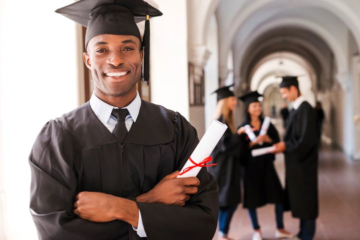 college graduate holding his diploma | Burke Subaru in Cape May Court House NJ
